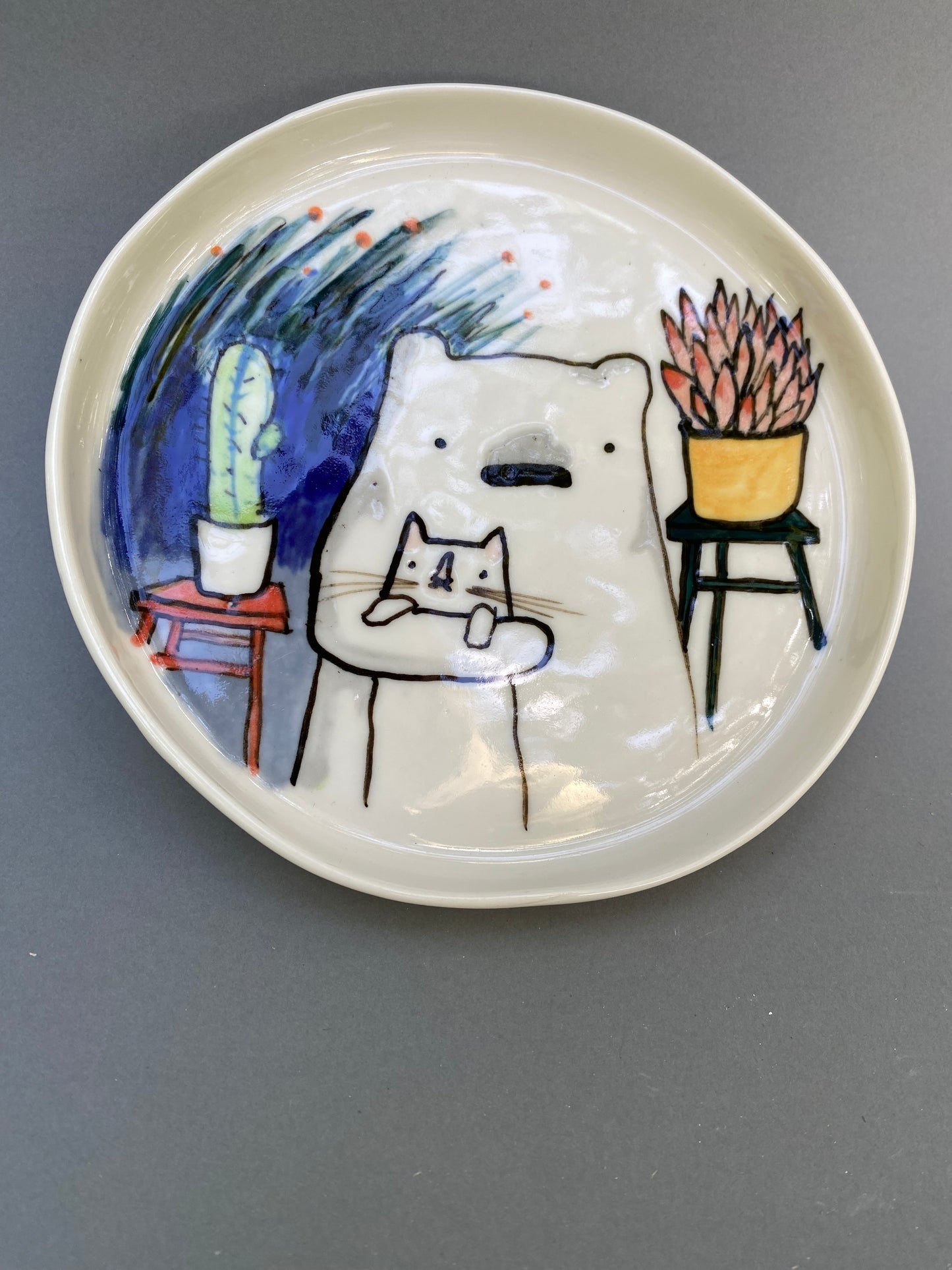 Bear, cat and some plants
