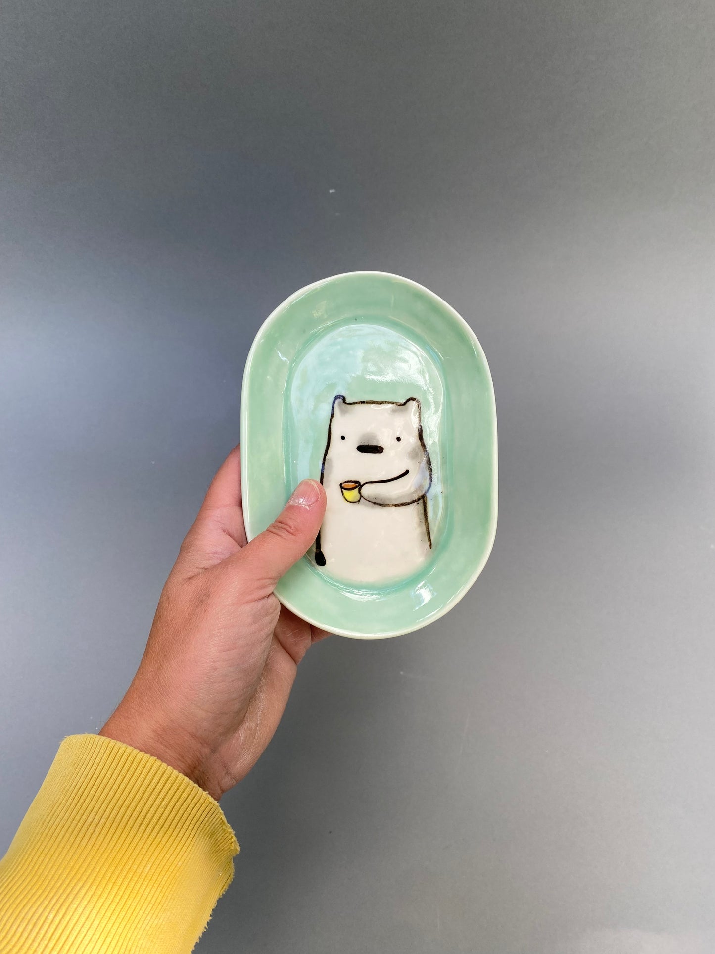 Bear drinking coffee