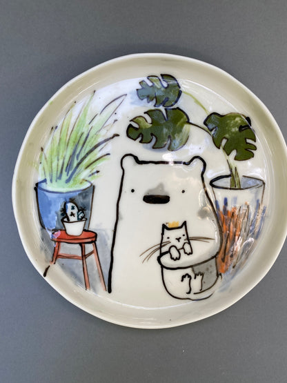 Bear with his cat and plants